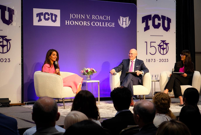 Amal Clooney with Dean Pitcock and Carrie Currier speaking at forum