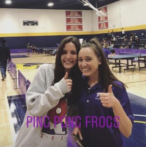 Hannah and a friend give thumbs-up at a ping pong tournament