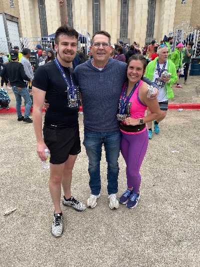 Dawson (left) and his sister (right) after finishing the Cowtown Marathon
