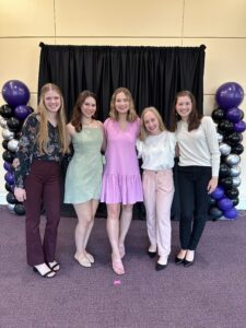Five Honors students stand shoulder-to-shoulder