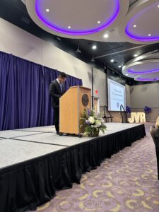 Honors student speaks from the lecturn during the banquet