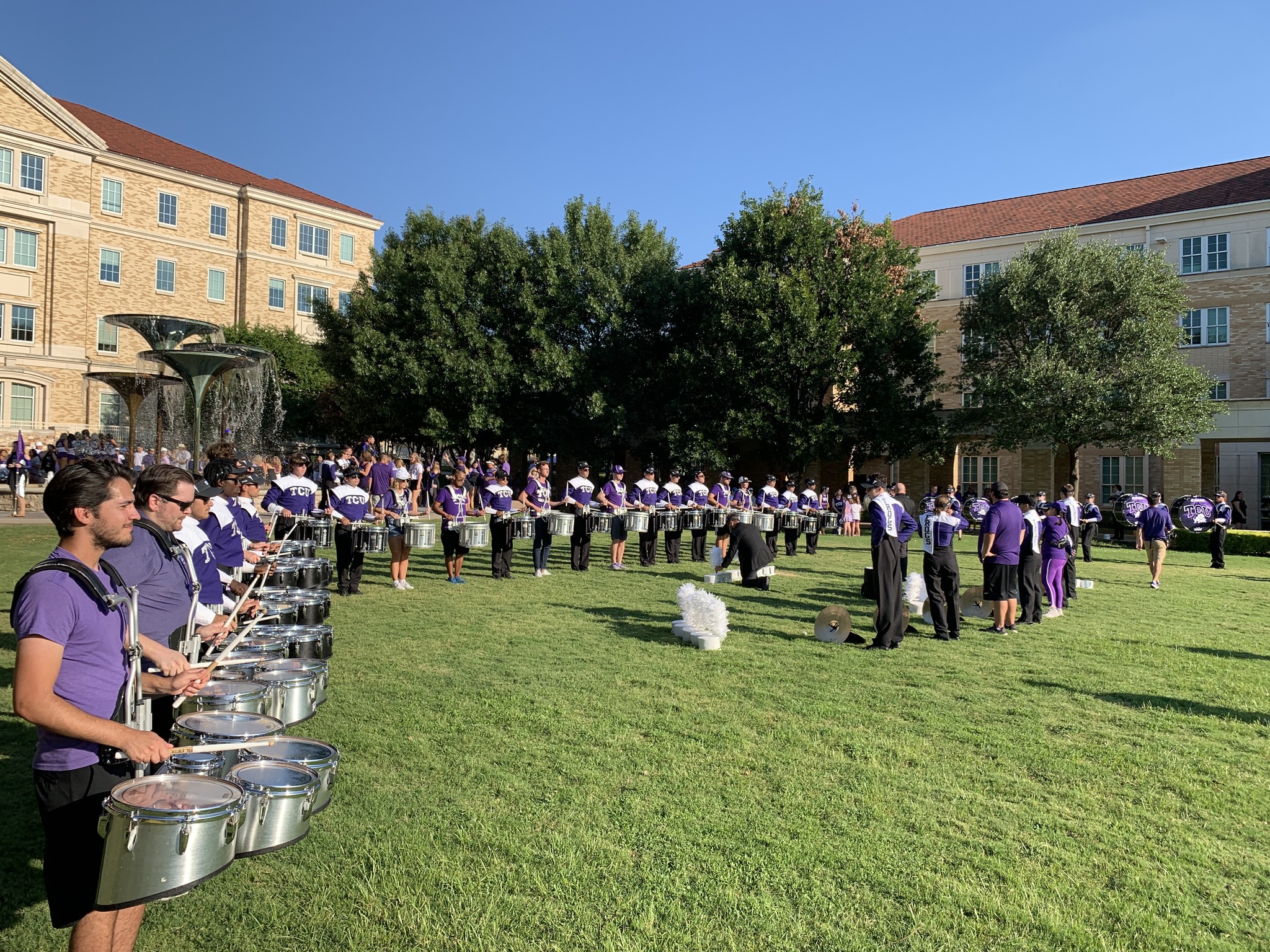 The drum line warming up with the alumni line (silver drums) before the Tarleton State game