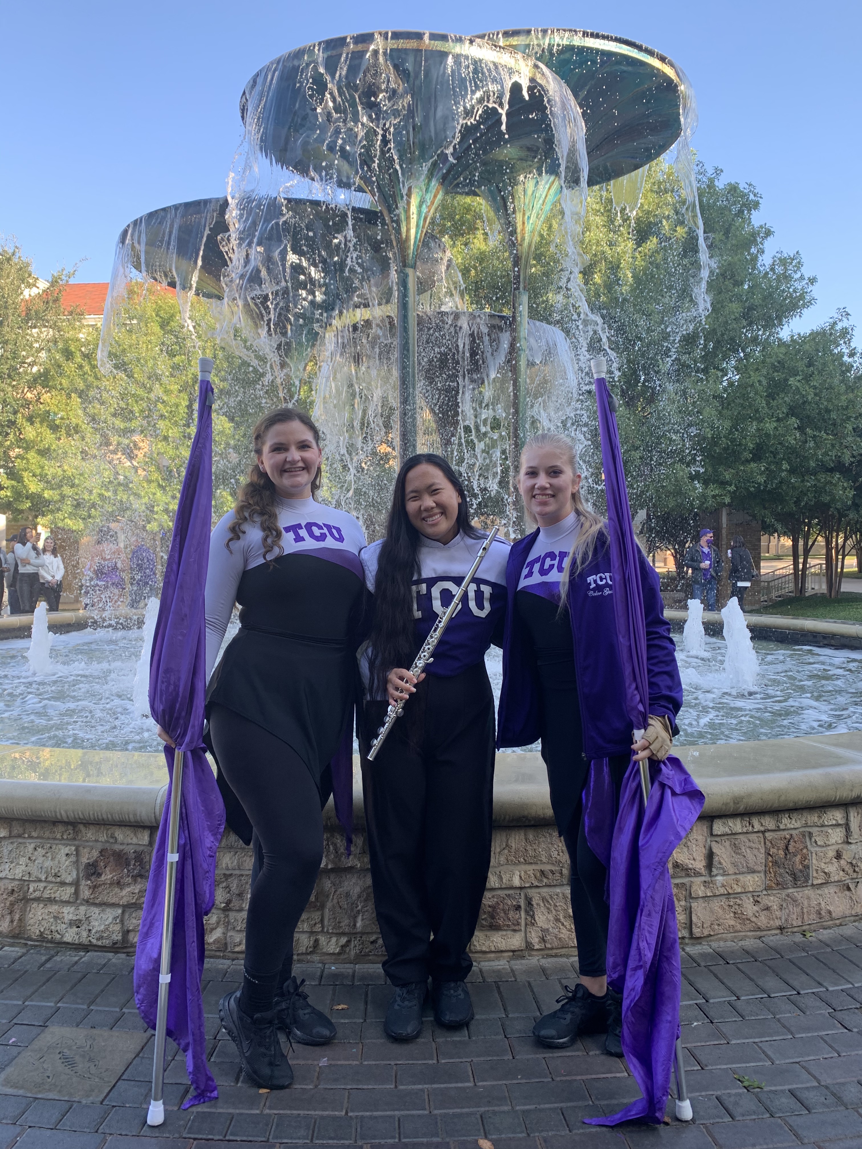 Leah and bandmates in front of Frog Fountain