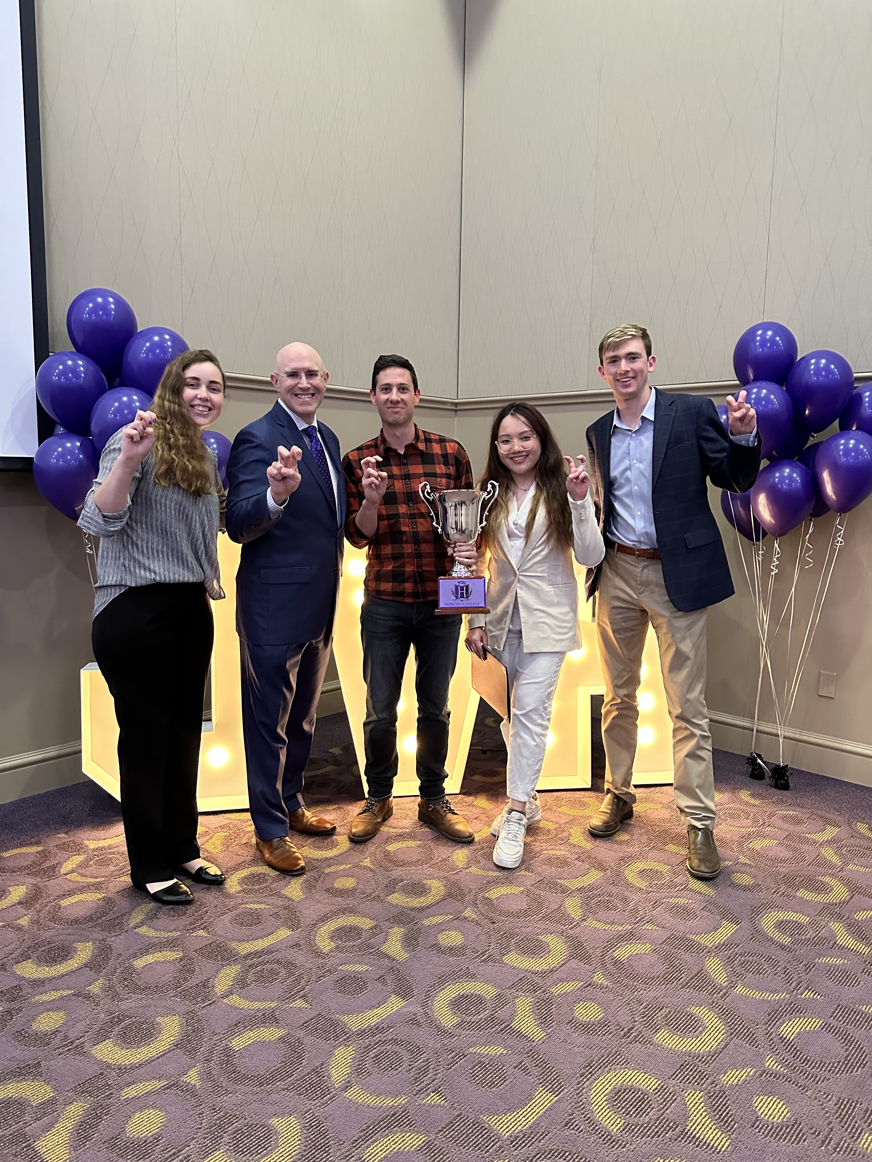 Zackary Hawley, 2023 Honors Professor of the Year, with students and Dean Ron Pitcock