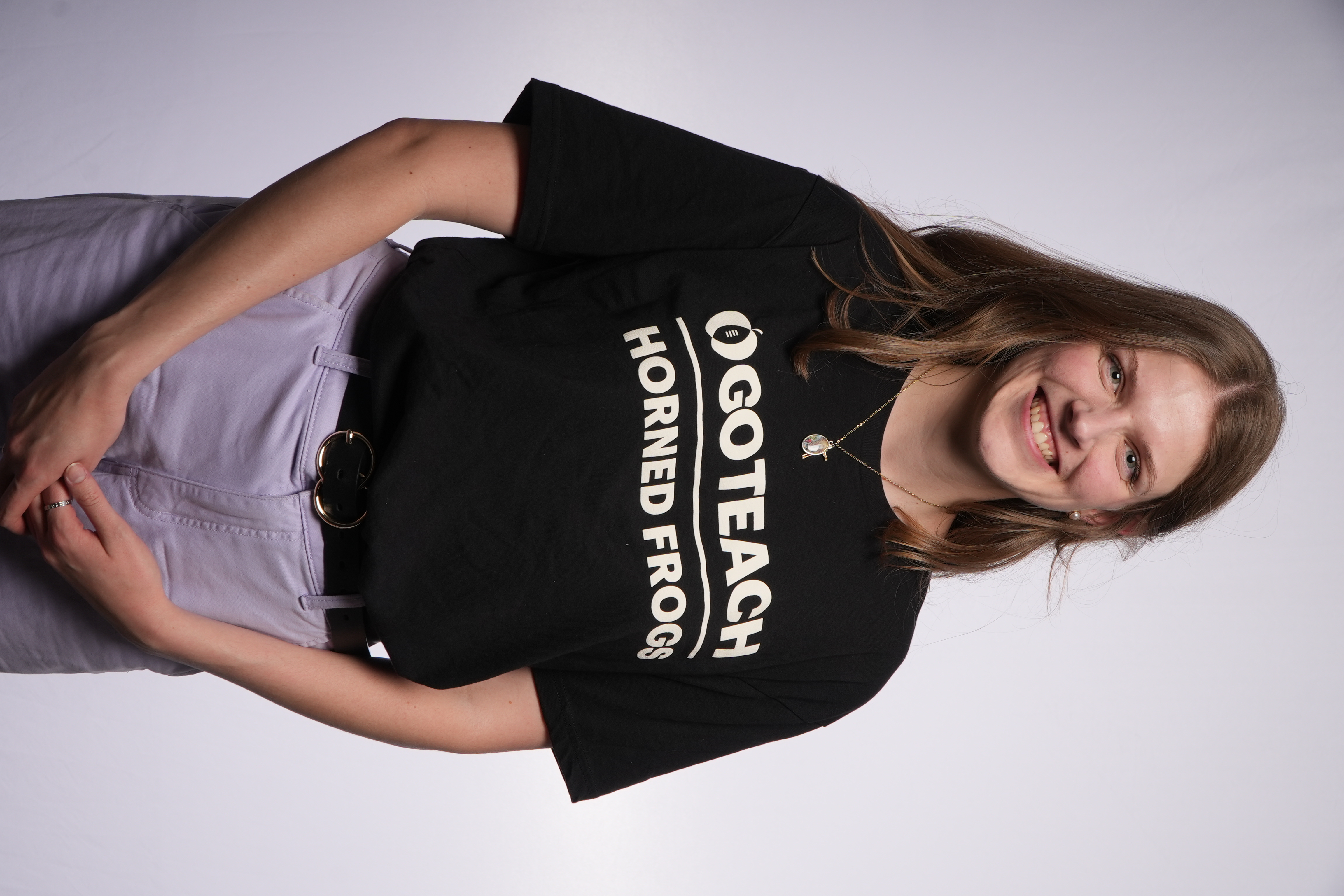 Jalyn Gryskiewicz wearing shirt reading "Go Teach Horned Frogs"