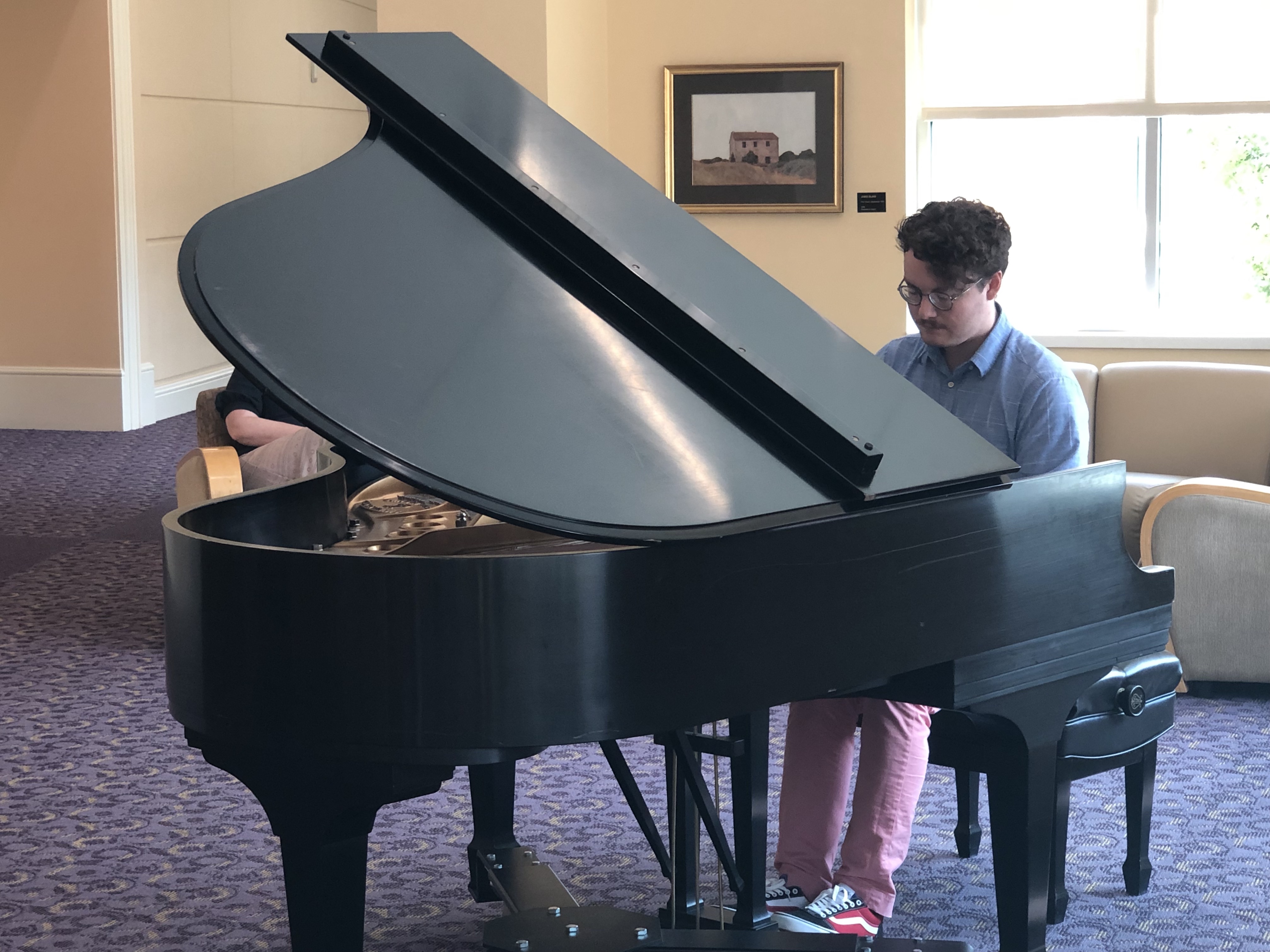 Andrew, organizer of “Piano at the BLUU” performing music of Schubert